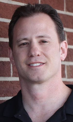 Professional headshot of Dean Volk