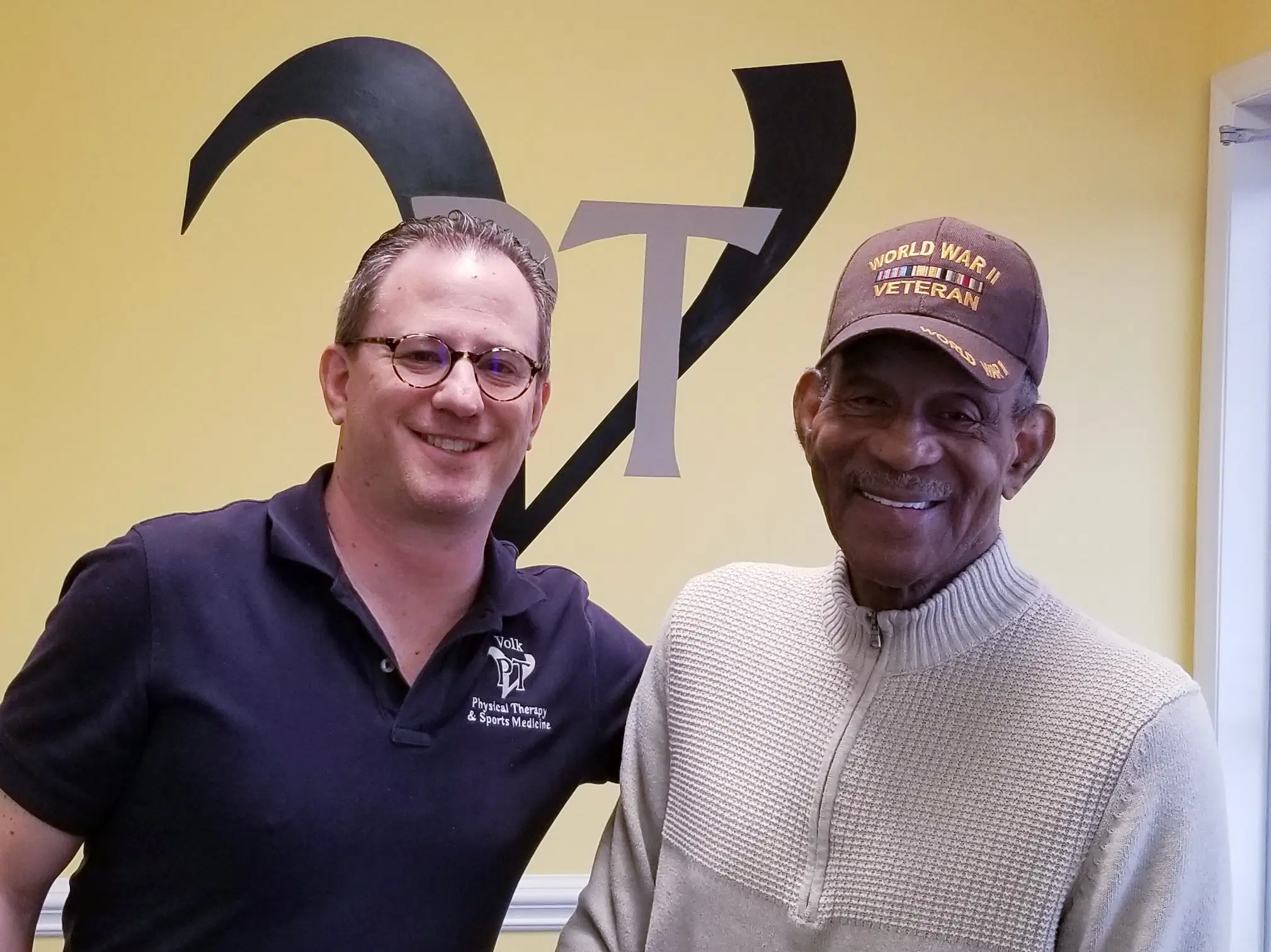A success story showing a specialist with a veteran client, demonstrating the life-changing results of the 180° Sciatica Solution for all ages.